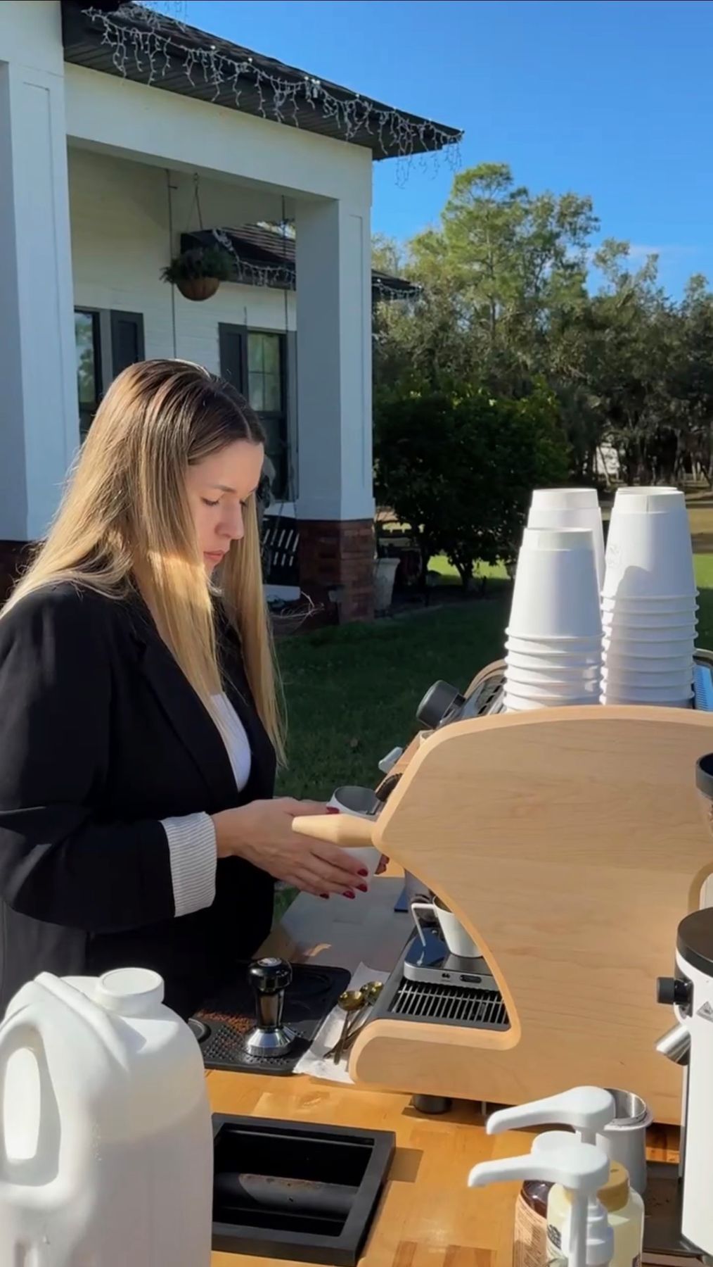 Barista pulling espresso at an outdoor event