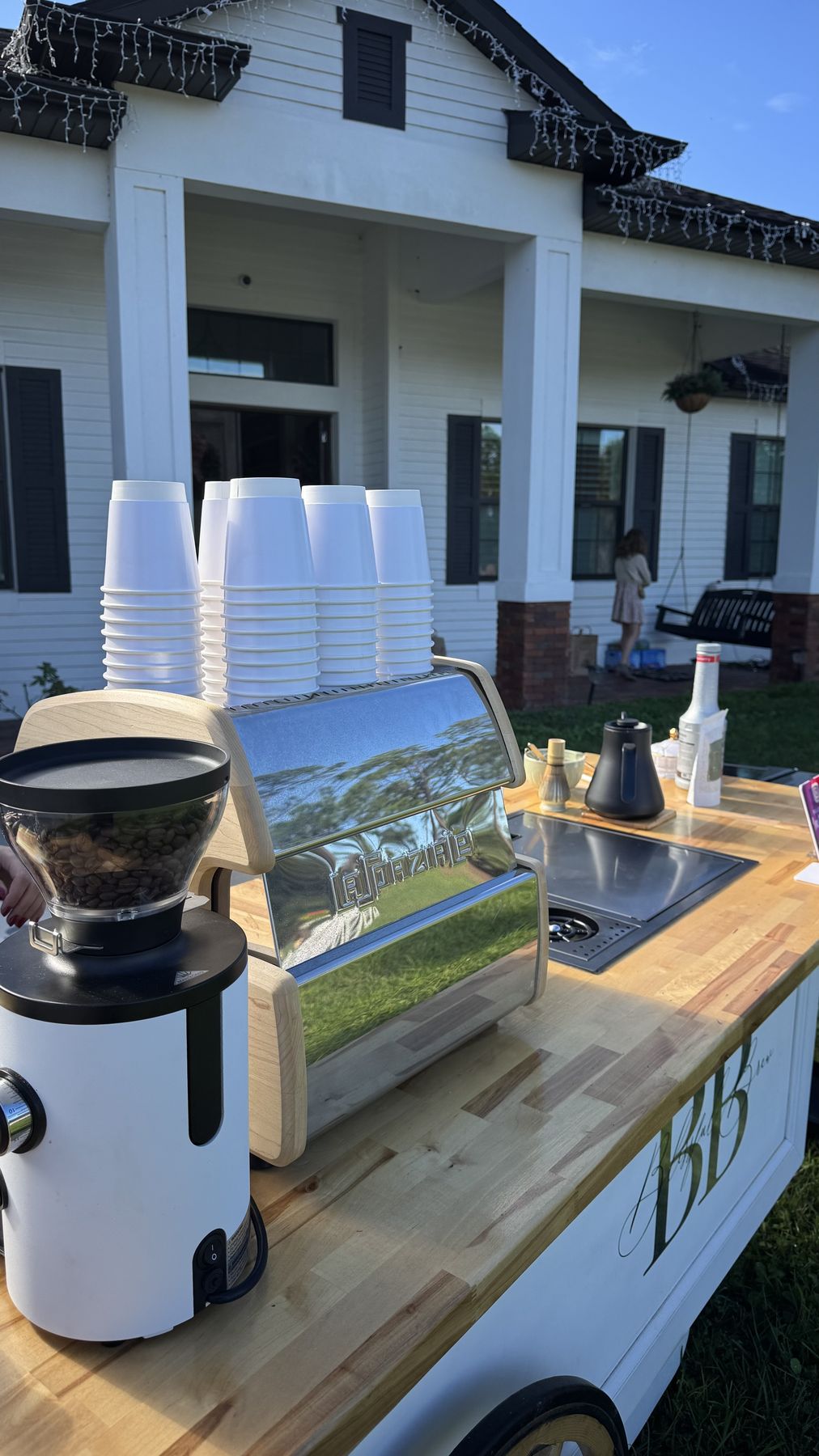 Coffee cart with espresso setup on the lawn