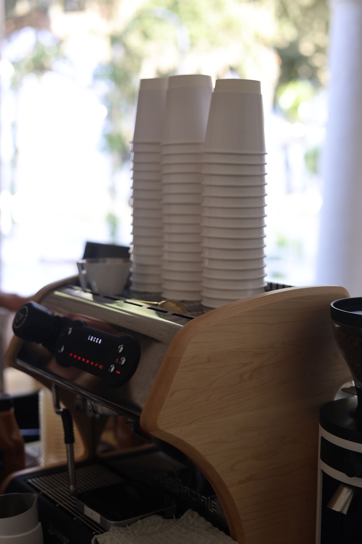 Stacked cups on top of the espresso machine