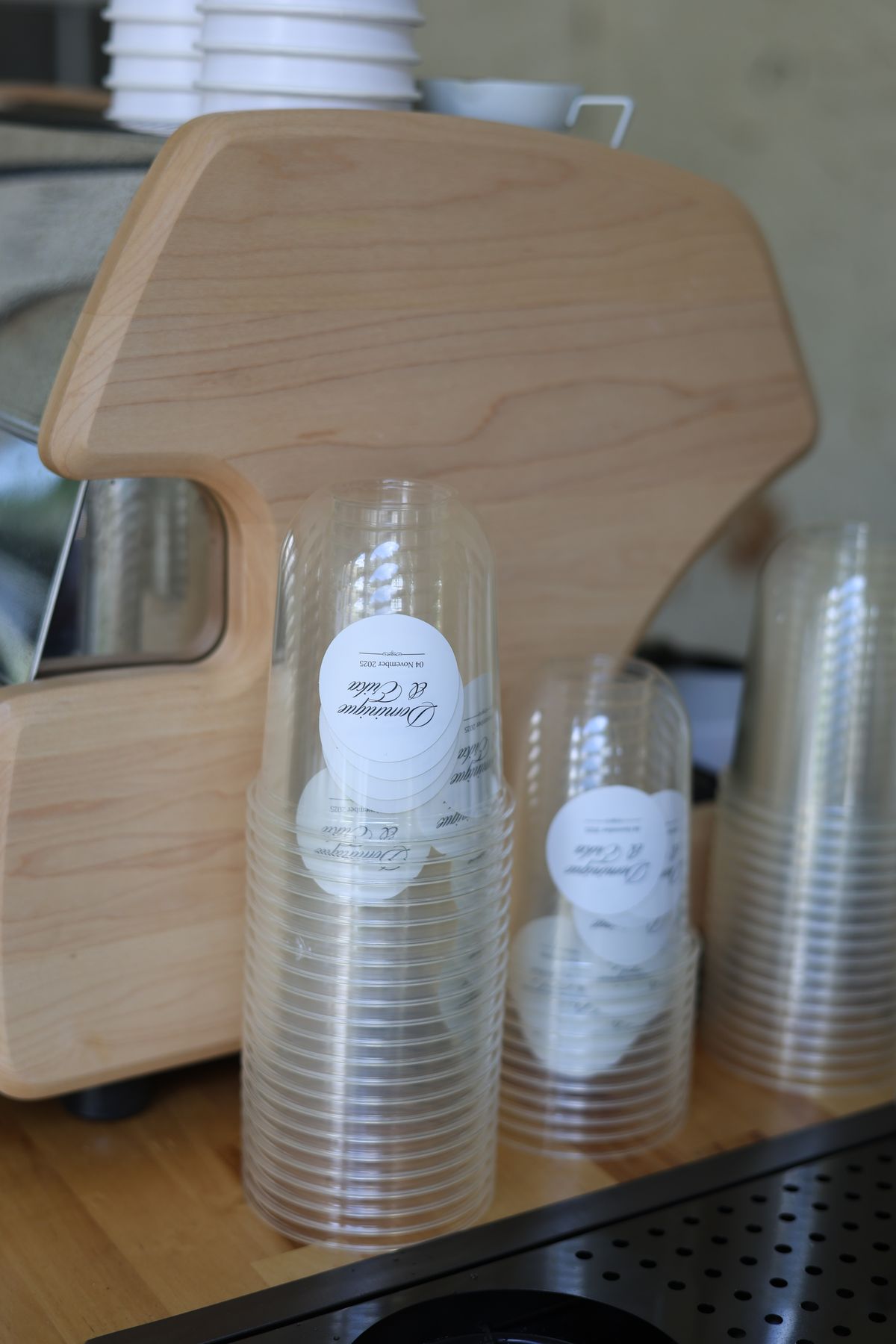 Stacked clear cups with custom labels